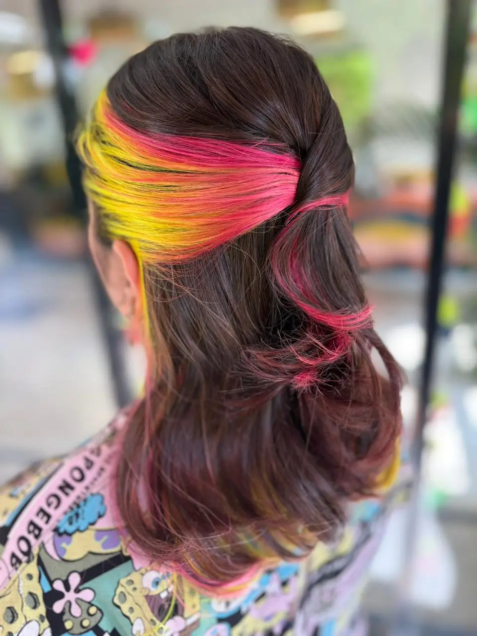 Neon colour hair service with pink and yellow highlights at Bizarre Salon